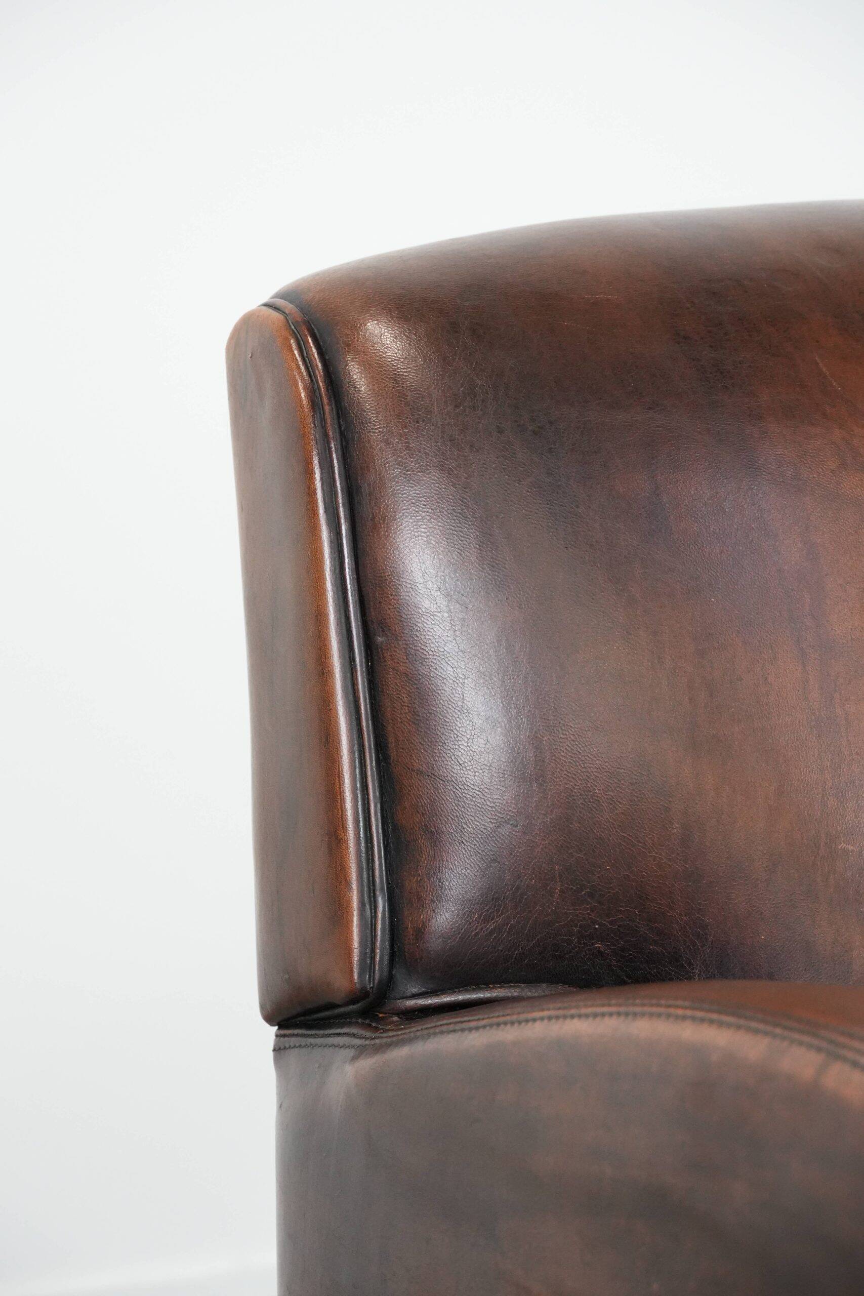 Beautifully shaped vintage sheepskin armchair with character