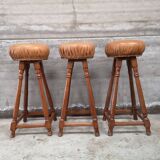 3 vintage oak and leather bar stools from the 1970s