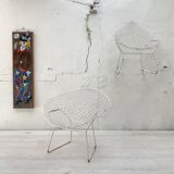 Pair of armchairs in white patinated mesh metal.