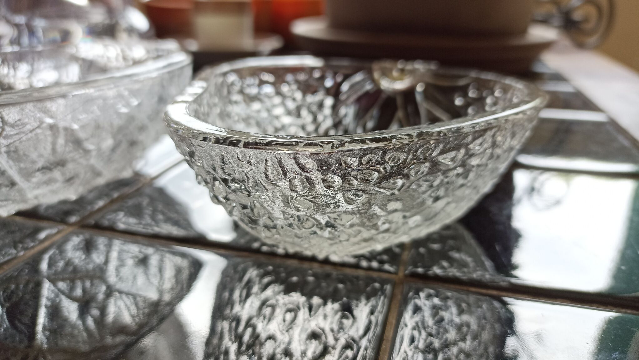 Two molded glass cups in the shape of strawberry and pineapple