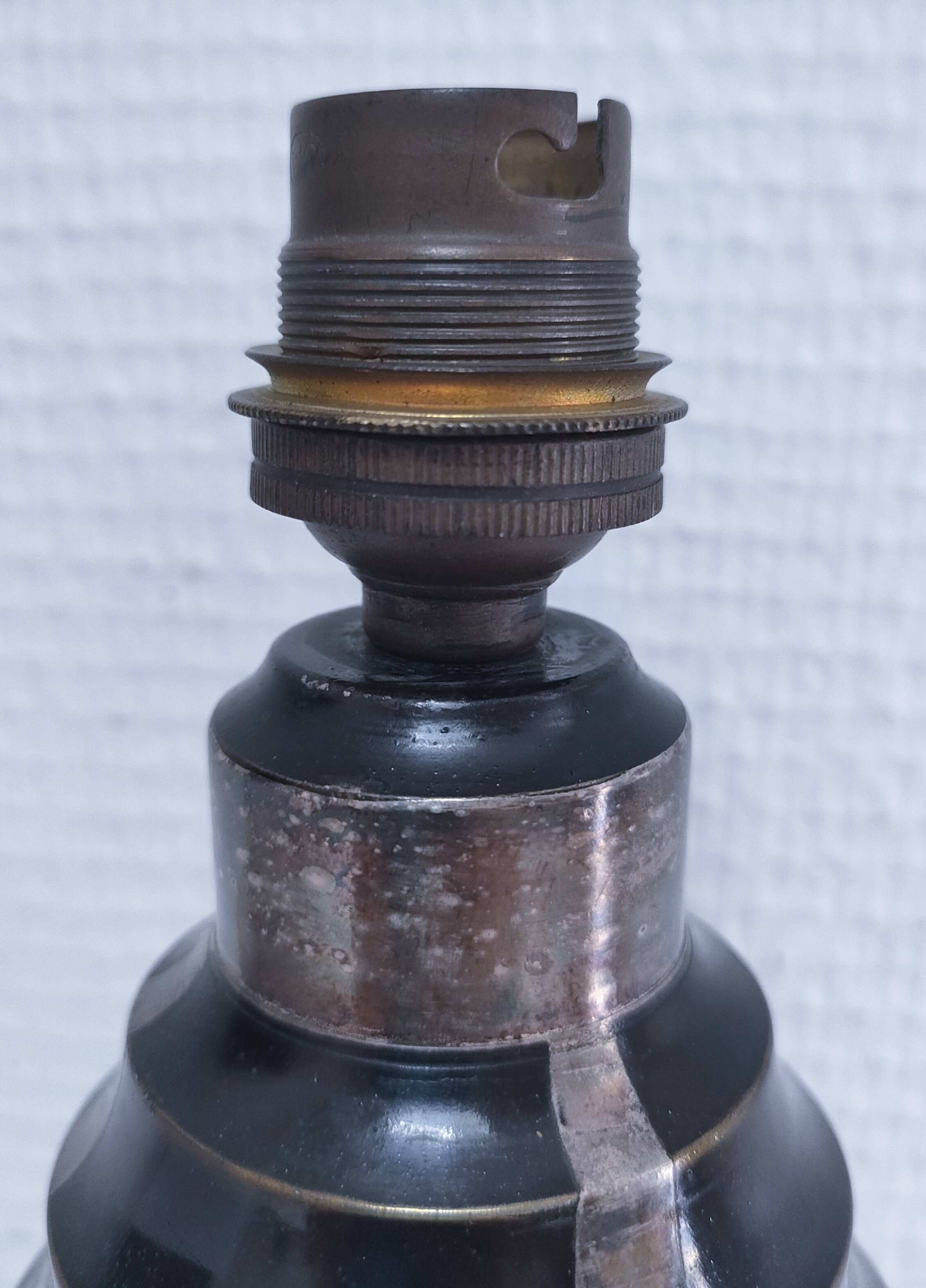 Art Deco metal lamp base with black and silver patina