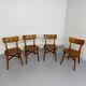 Set of 4 vintage solid oak chairs, 1960s design with sculpted backrest.