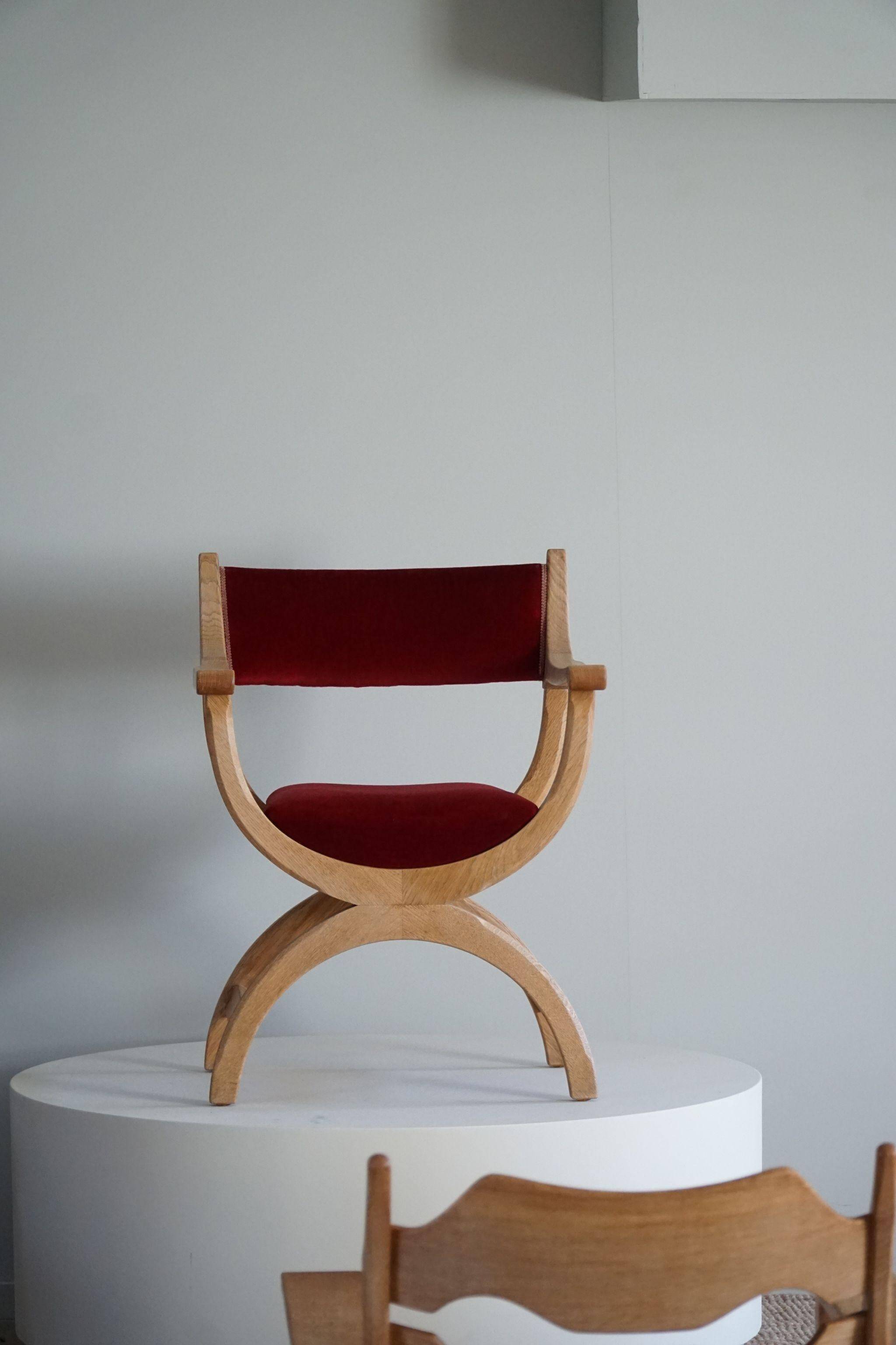 Henning Kjærnulf, armchair in oak and velvet, model "Kurul", mid-century, 1960s.