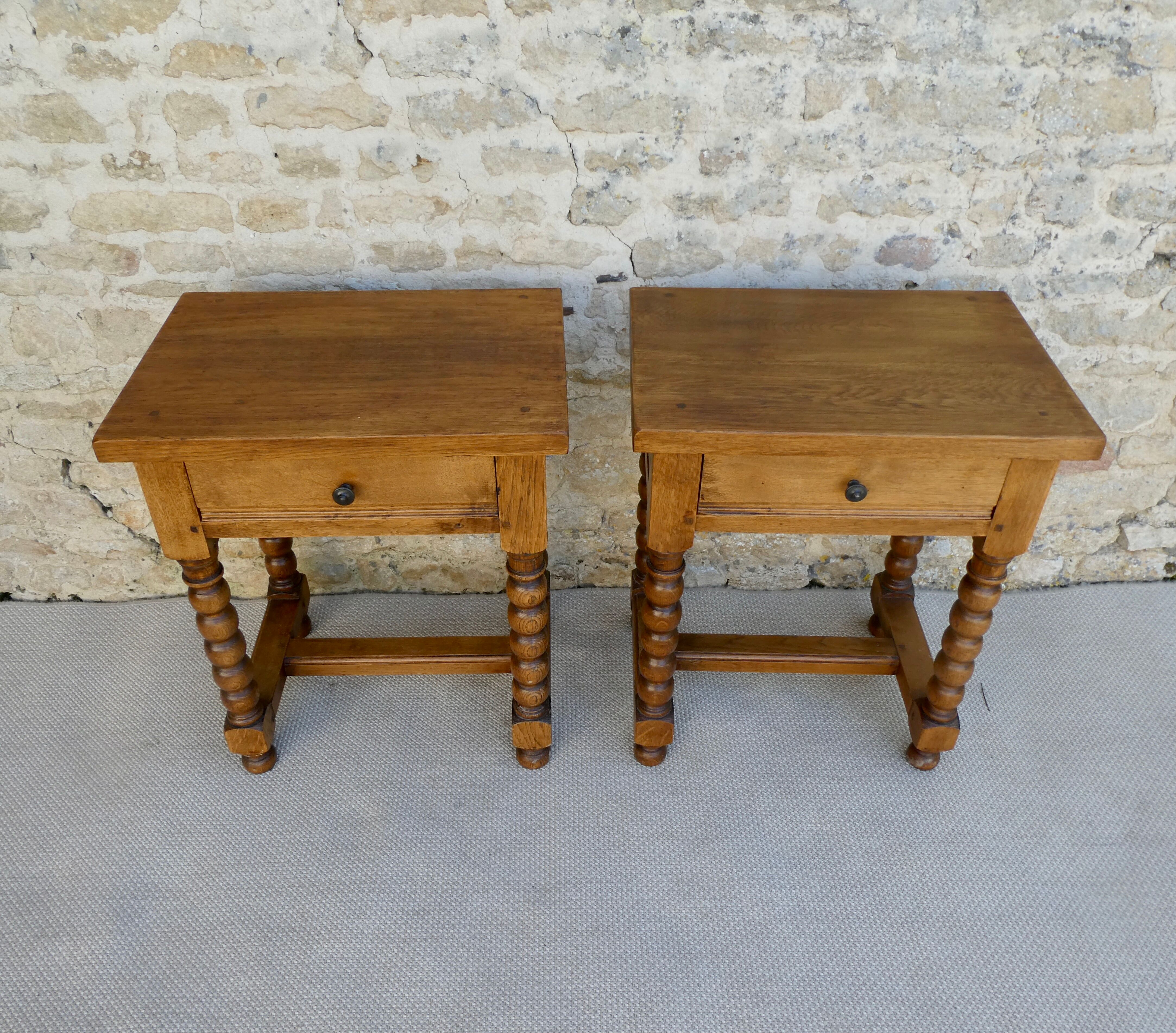 Pair of solid oak bedside tables with carved legs