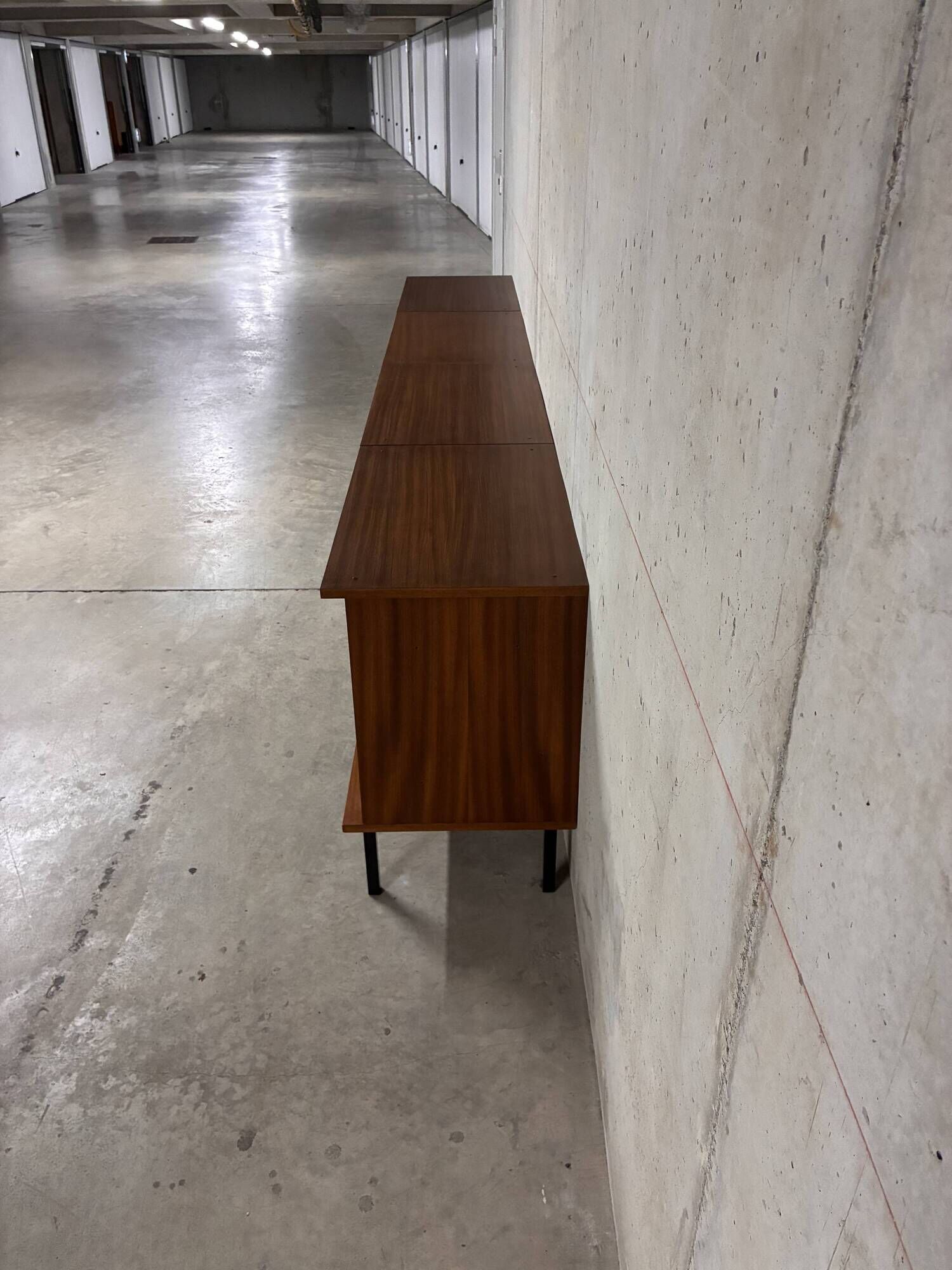 Enfilade buffet display cabinet in vintage 1950s style.