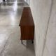 Enfilade buffet display cabinet in vintage 1950s style.