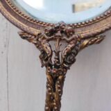 Mirror face to hand gilded bronze knot ribbon