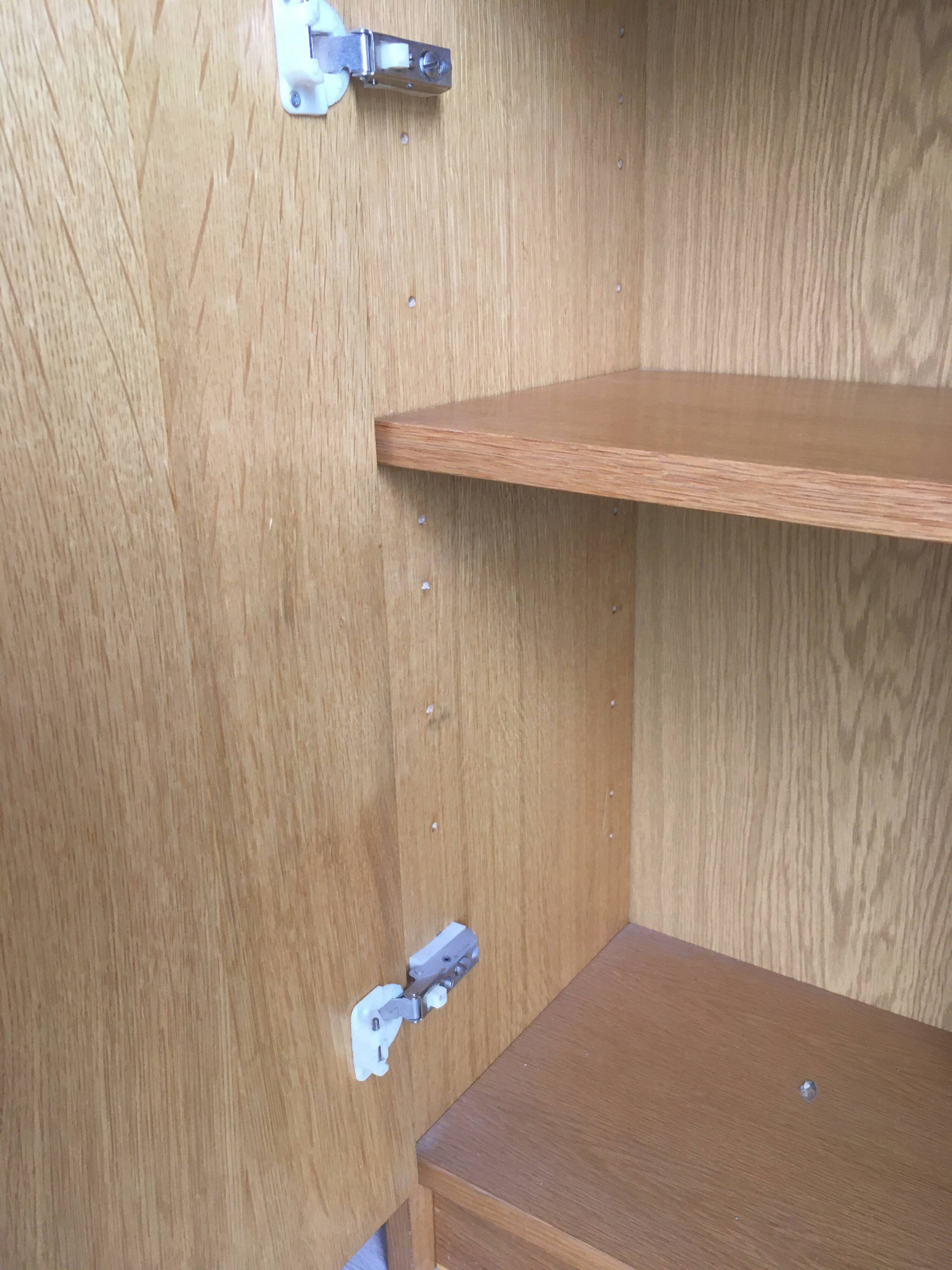Dressing vintage Scandinavian style in light wood with wardrobe and cupboard.