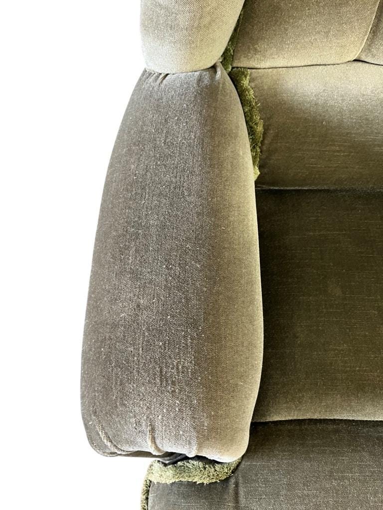 Vintage green two-seater sofa with fringes