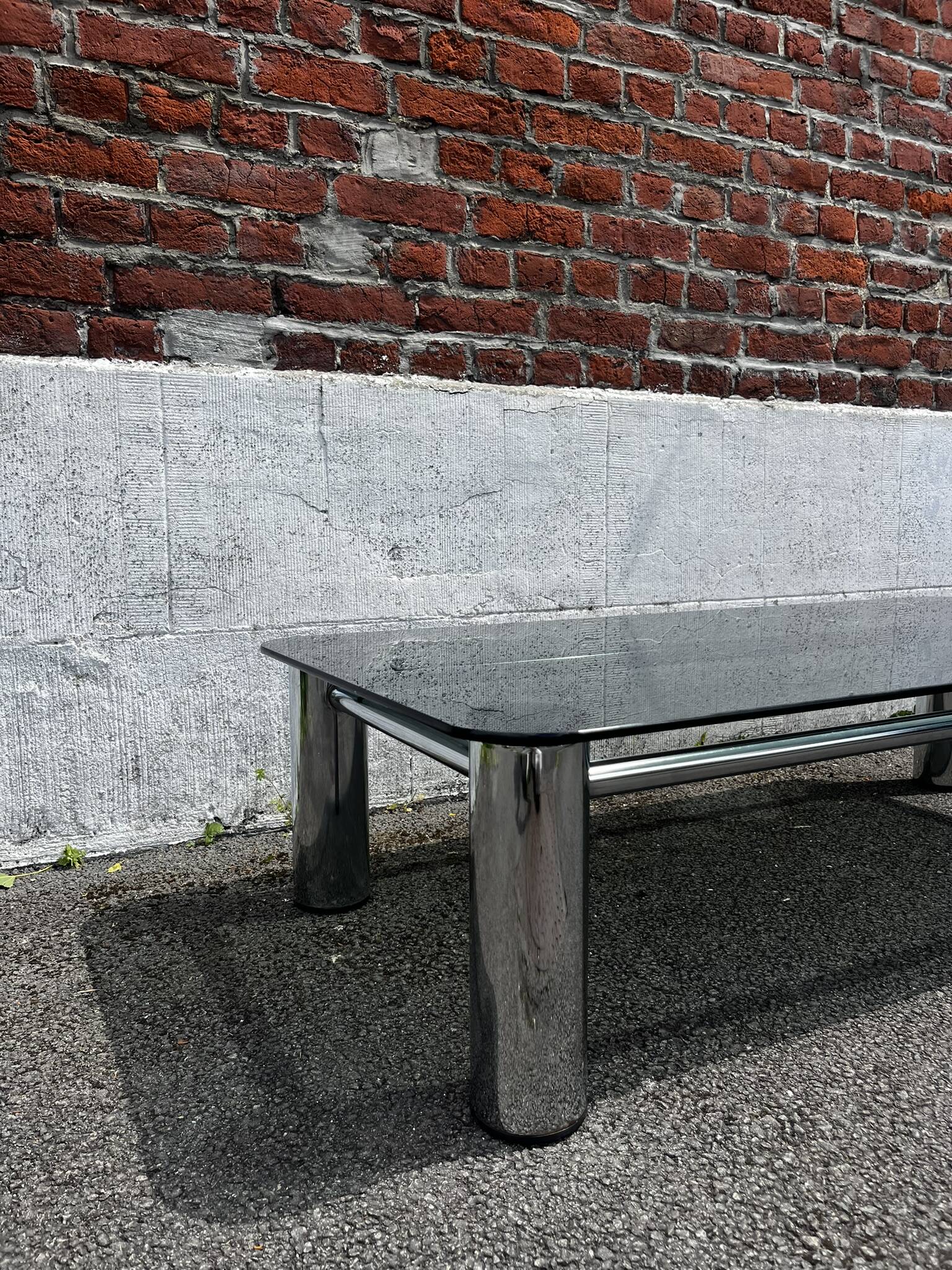 Vintage coffee table with smoked glass and chrome.