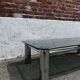 Vintage coffee table with smoked glass and chrome.