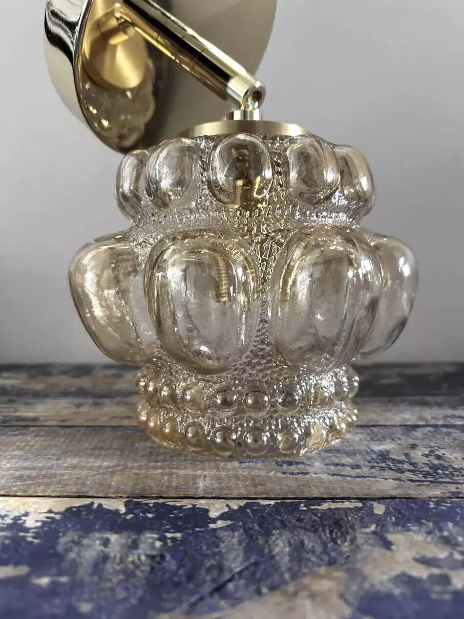 Gold tilting wall light