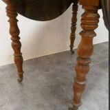 Walnut shuttered table, on casters