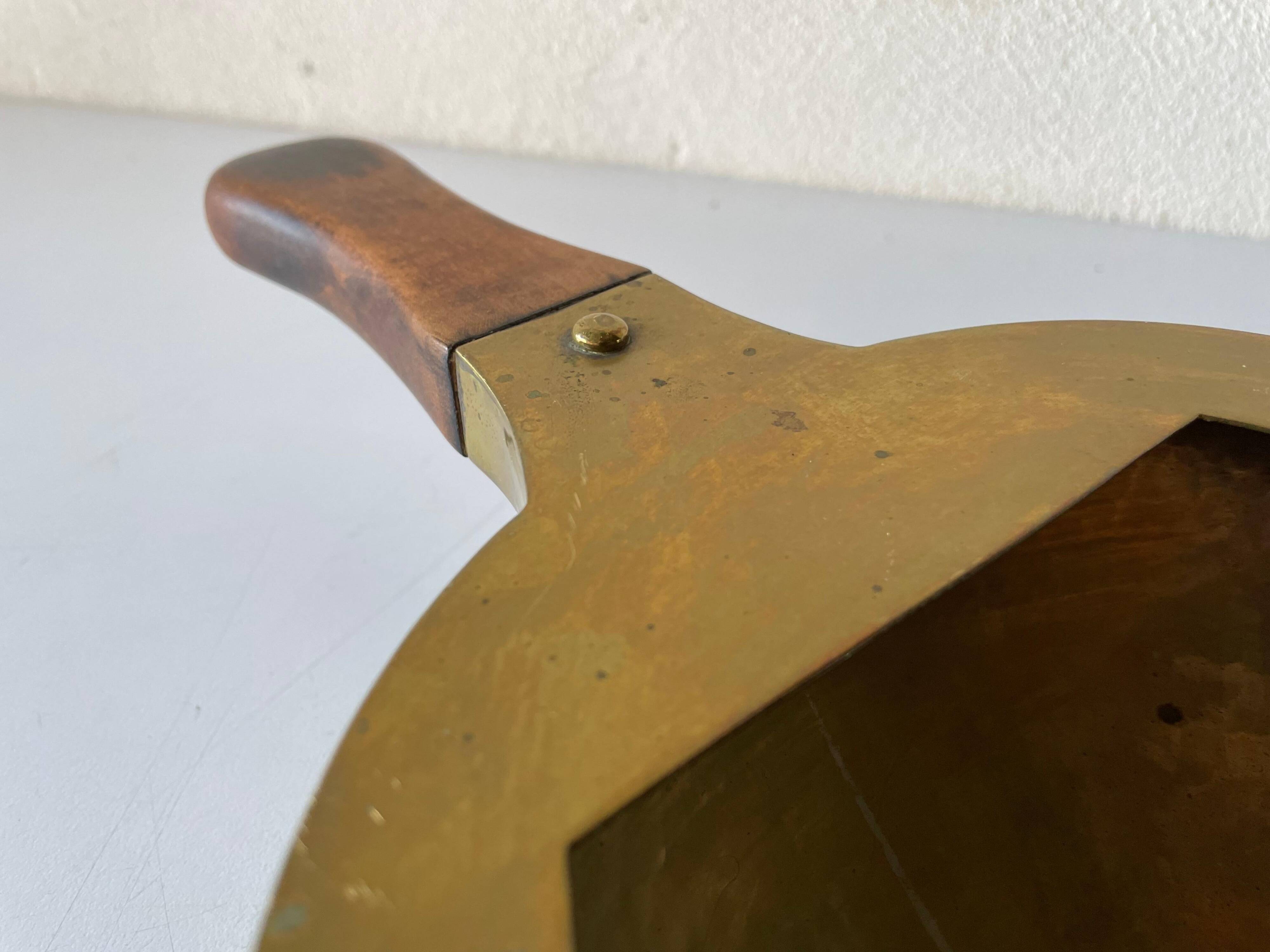 Decorative brass bowl with wooden handle, 1970s, Turin, Italy.