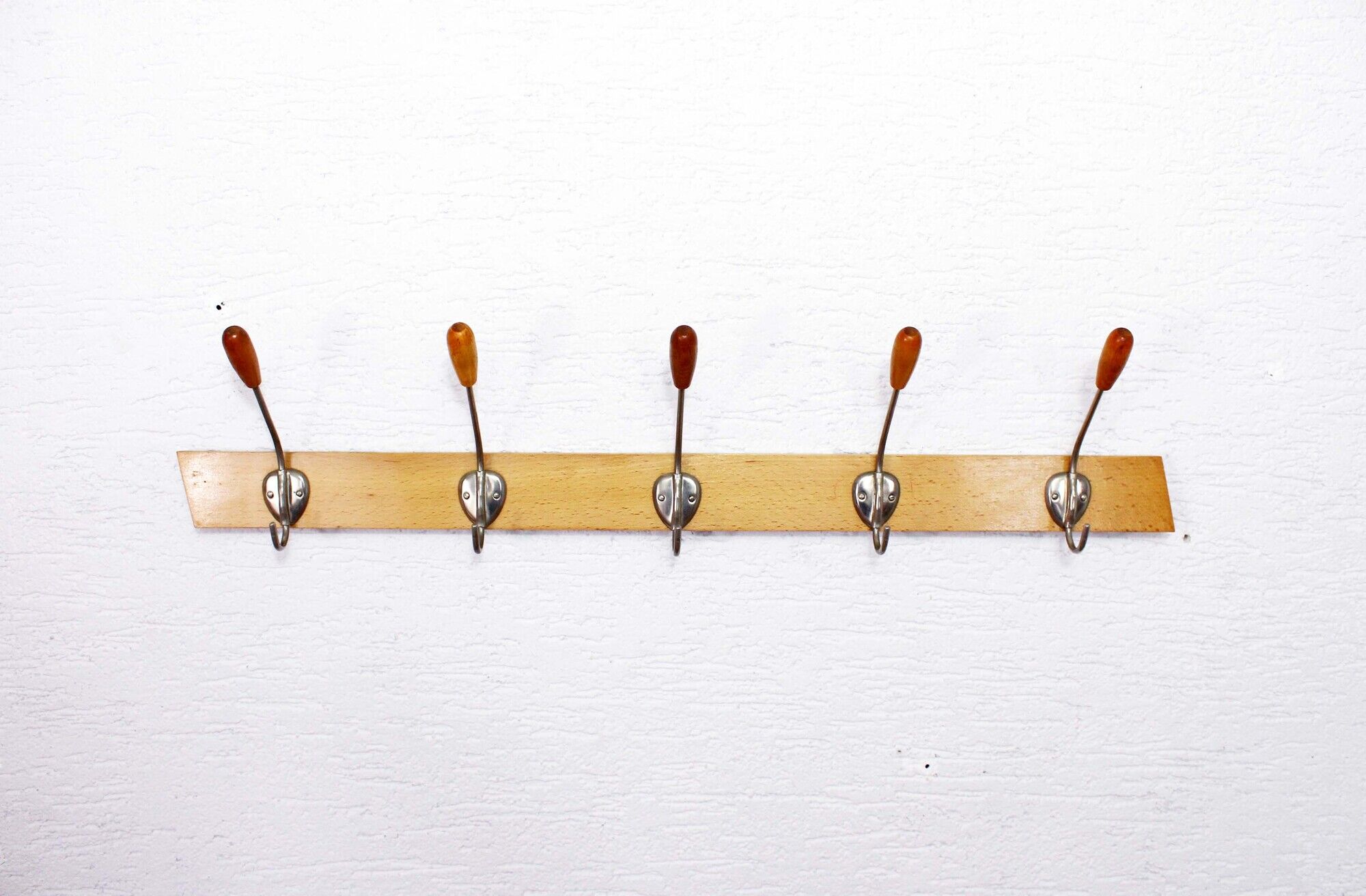 Peg wood and metal, wearing vintage coat