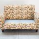 2-seater sofa, floral fabric, wooden structure, plastic and wooden legs, 1970
