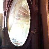 Coat rack with oval mirror