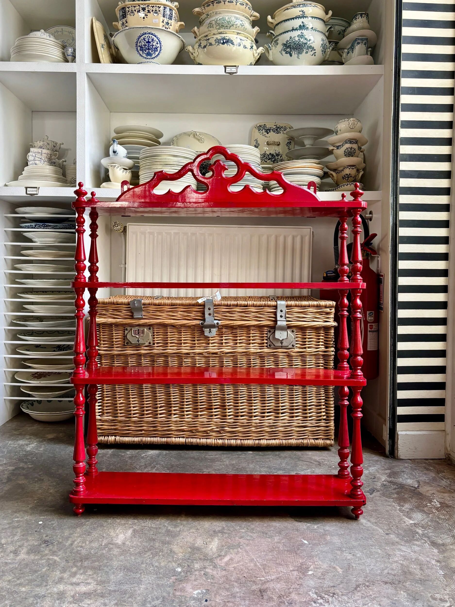 Wall shelf with 4 red lacquered wooden shelves.