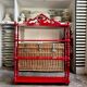 Wall shelf with 4 red lacquered wooden shelves.