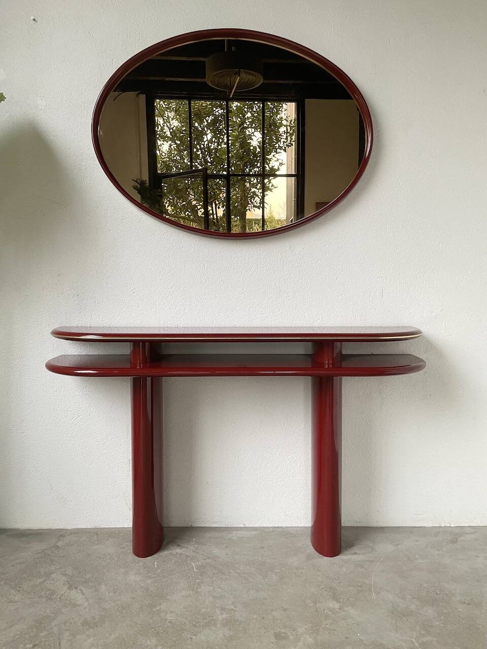 Red lacquered console and its mirror from the 80s
