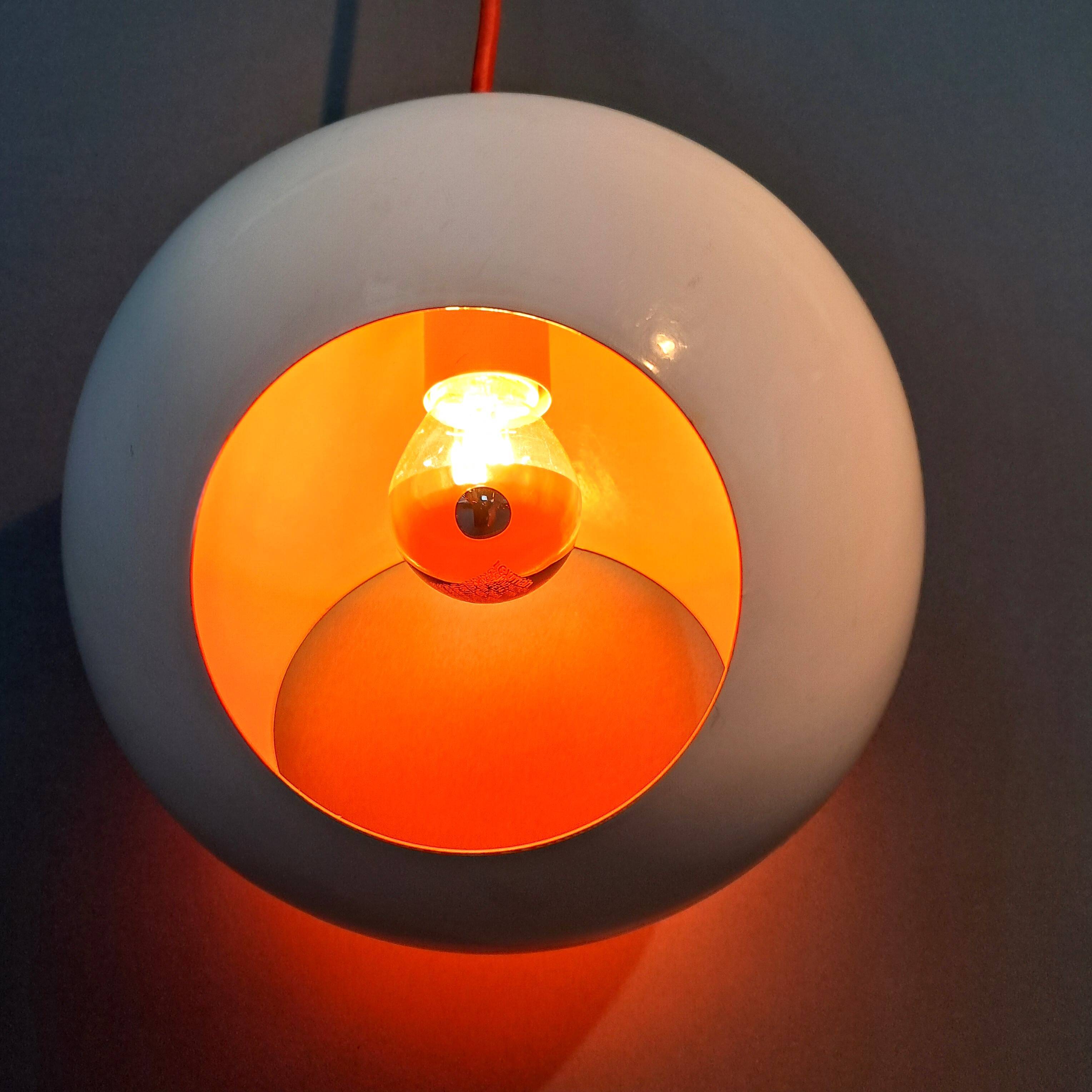 White openwork pendant light with orange interior 1970/1980.