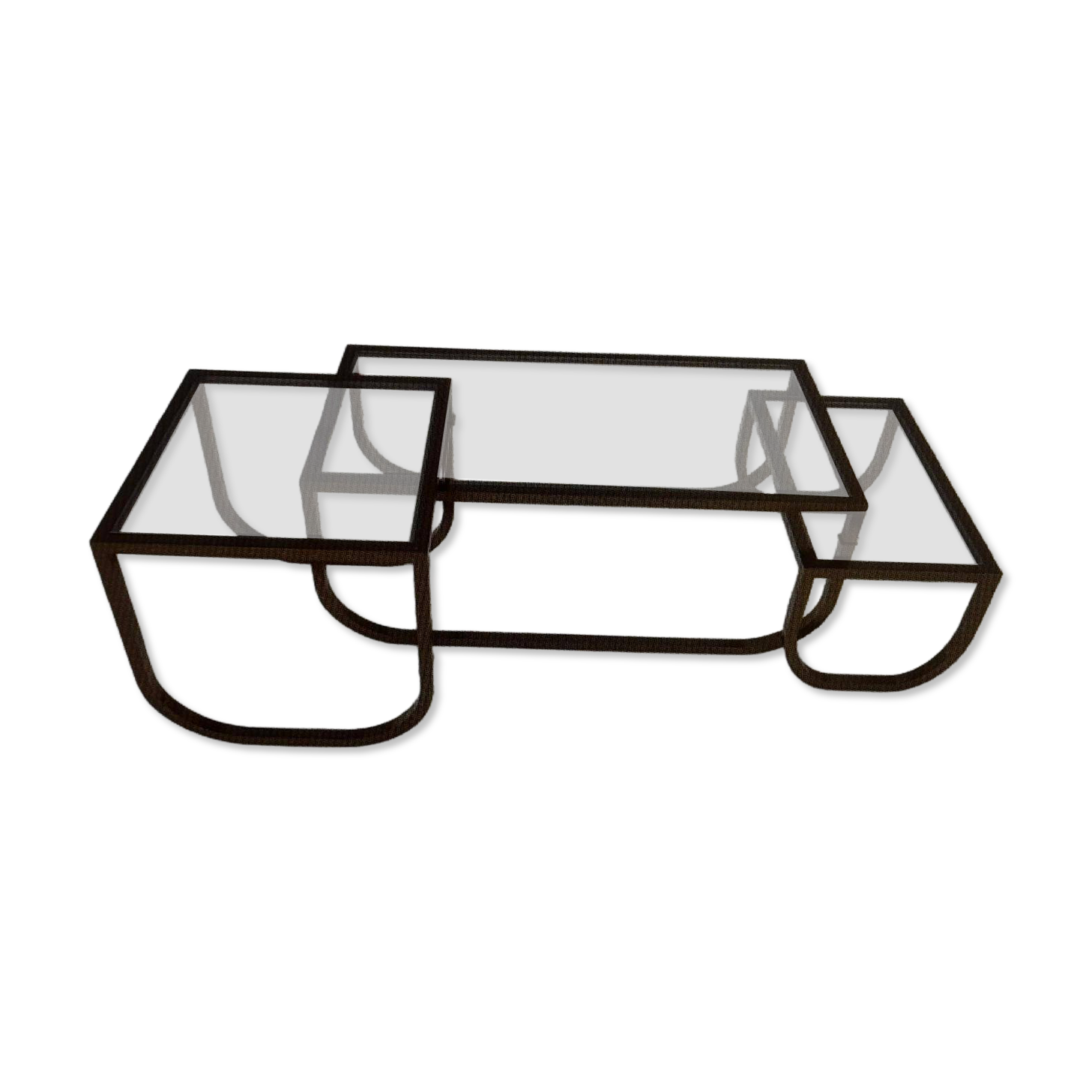 Asymmetrical metal-and-glass coffee table with curved architectural frame.