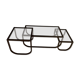 Asymmetrical metal-and-glass coffee table with curved architectural frame.