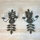 Pair of decorative wall sconces with sunflowers and patinated metal foliage.