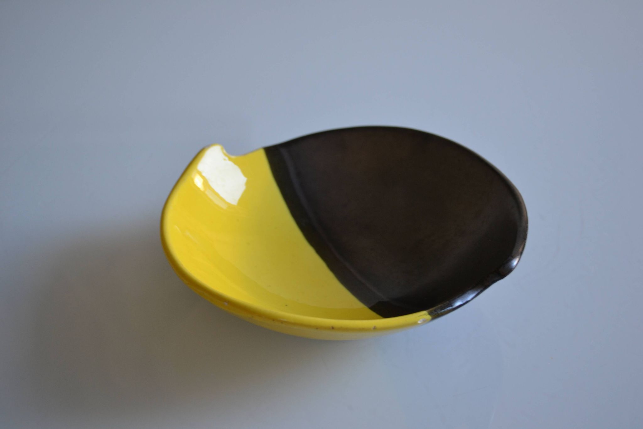 Bicolour ceramic cup in black and yellow signed Luc Vallauris 1950