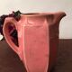 Old pitcher in earthenware of a very pretty pink