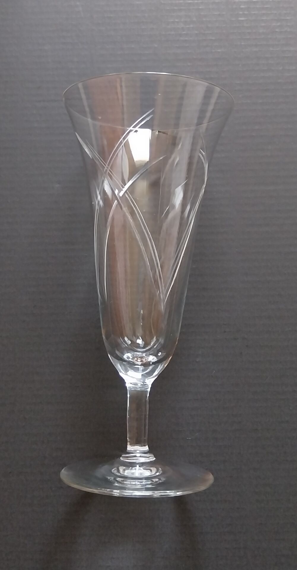 Old engraved crystal champagne flutes