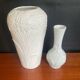 A pair of vintage vases in glazed porcelain.