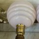 Pair of wall lights in wood, brass, and pink opaline.
