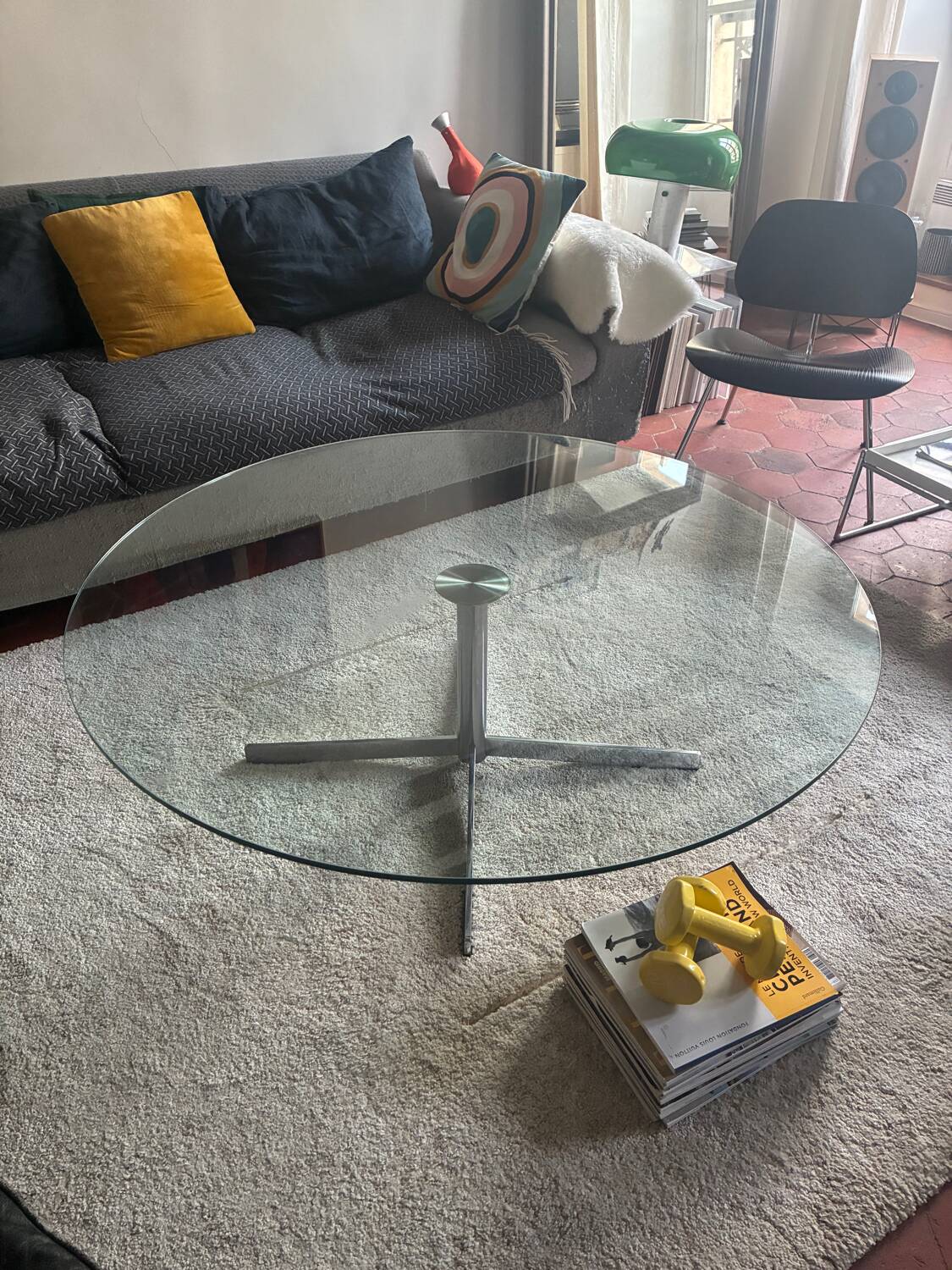 Glass coffee table with chrome base in the style of Roche Bobois