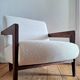 Izag ampm armchair, solid walnut and ecru-colored bouclette, designer seat