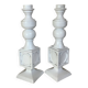 Pair of white resin candle holders