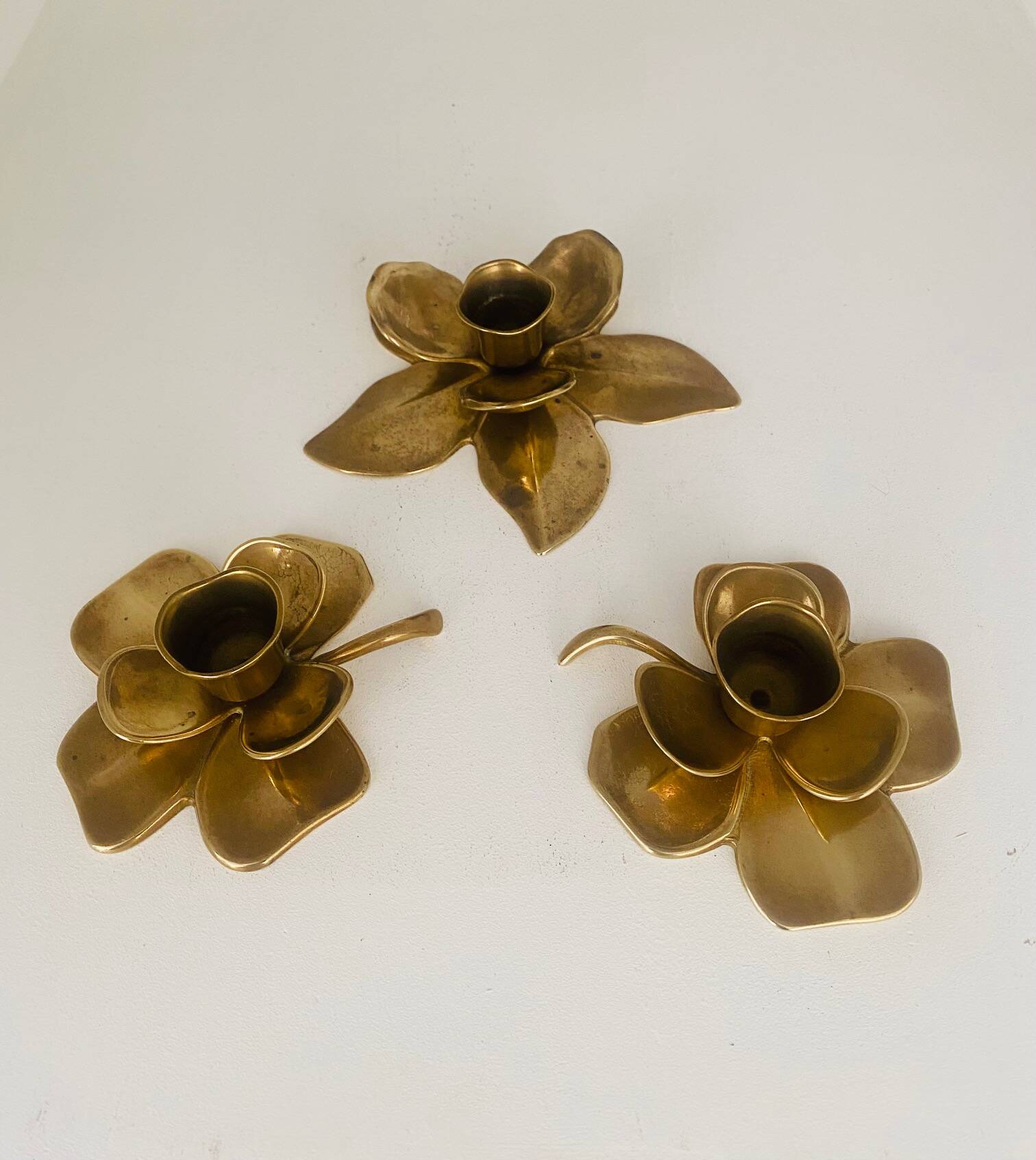 Set of 3 old brass candlesticks in the shape of flowers