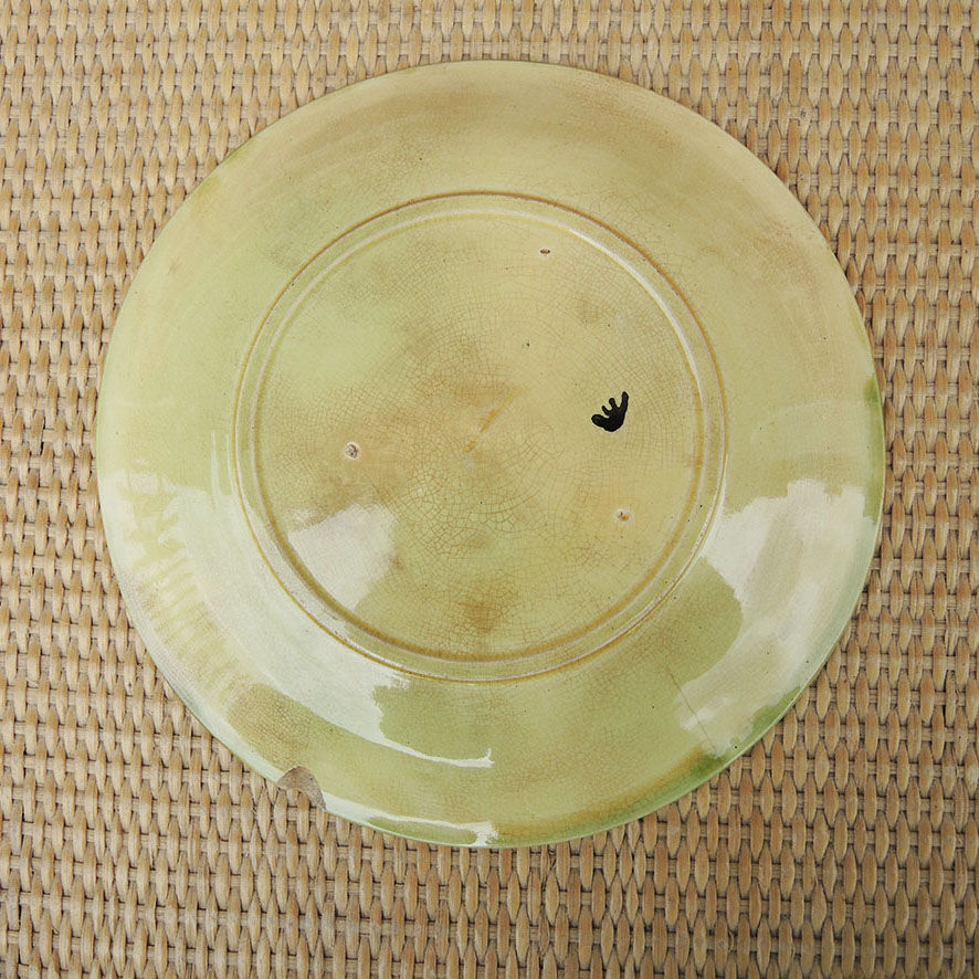 Old slipware plate: vine leaves