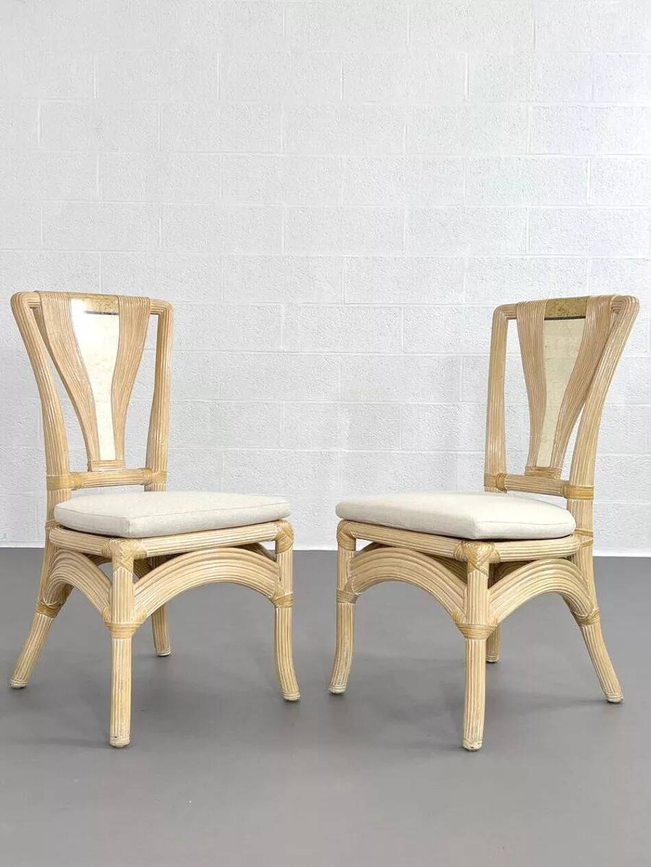 1970s rattan table with stone marquetry and matching chairs.