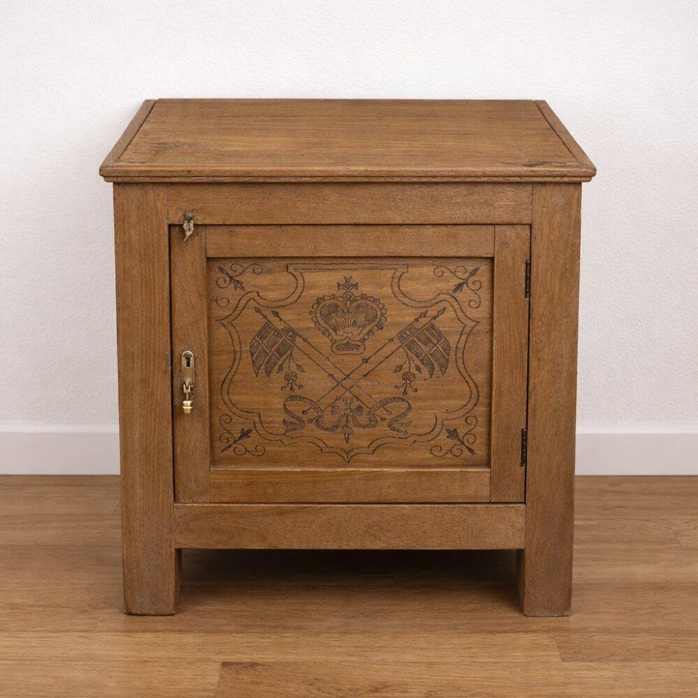 Oak side cabinet with carved motifs