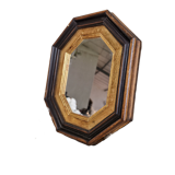 Antique mirror in black and gold octagonal wood