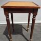 Pair of small flying tables dandy wrapped leather and gold vignette