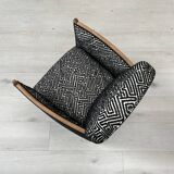 Club armchair in wood and fabric.