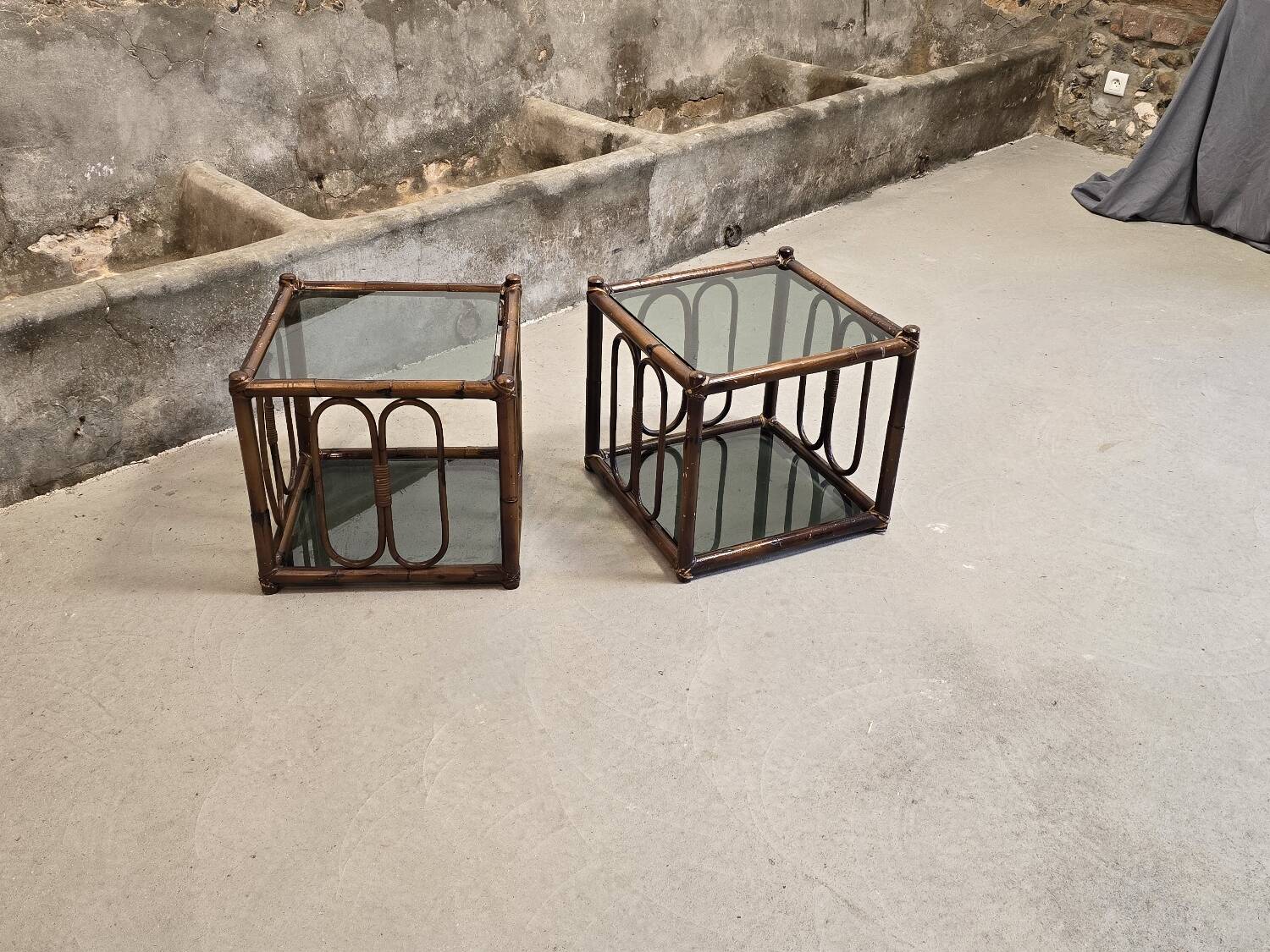 Two rattan and smoked glass tables, 1970