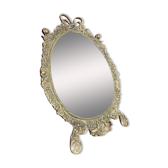 Antique baroque bronze mirror with floral patterns