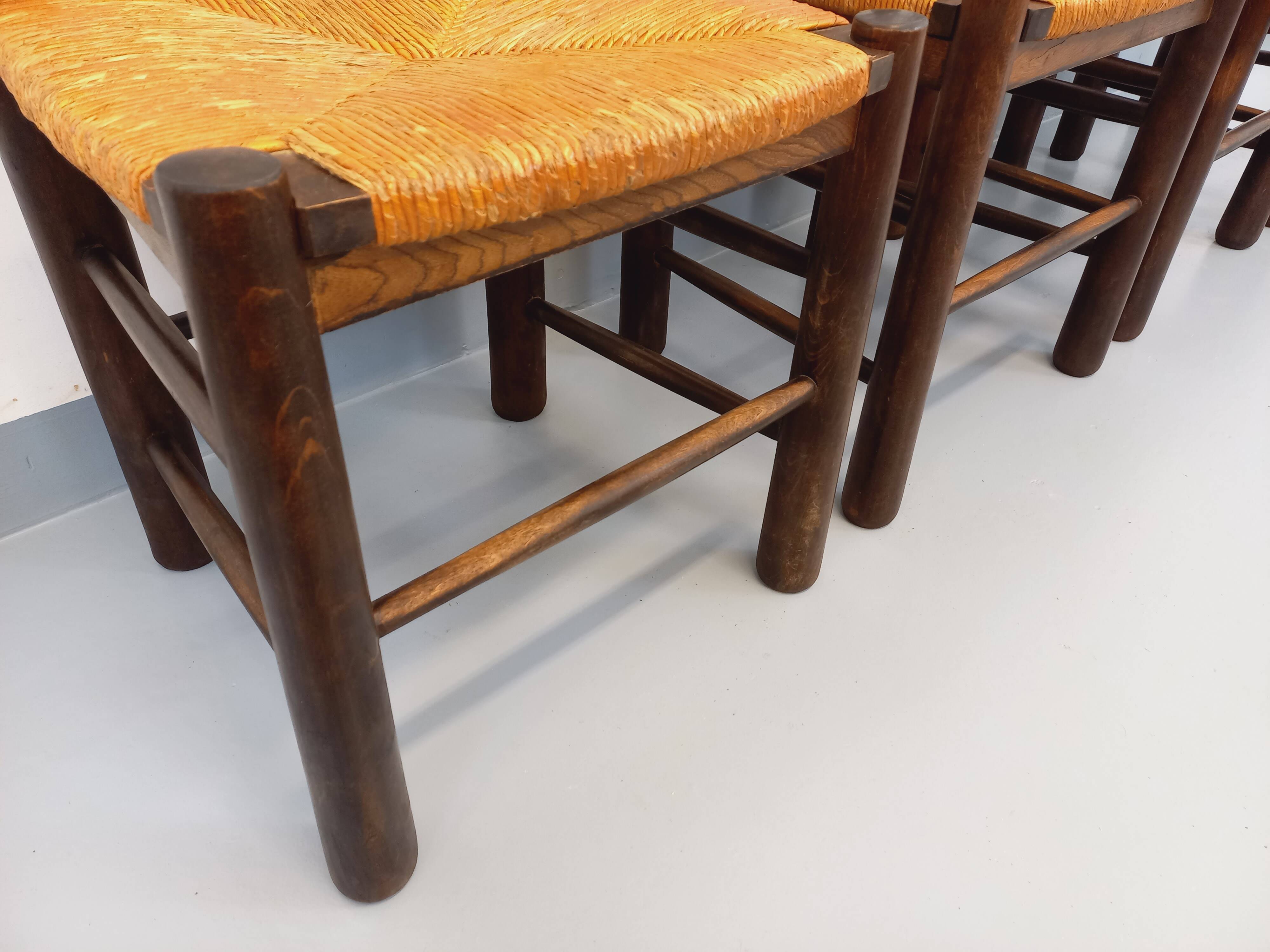 Set of 4 vintage brutalist chairs by Georges Robert in wood and straw.