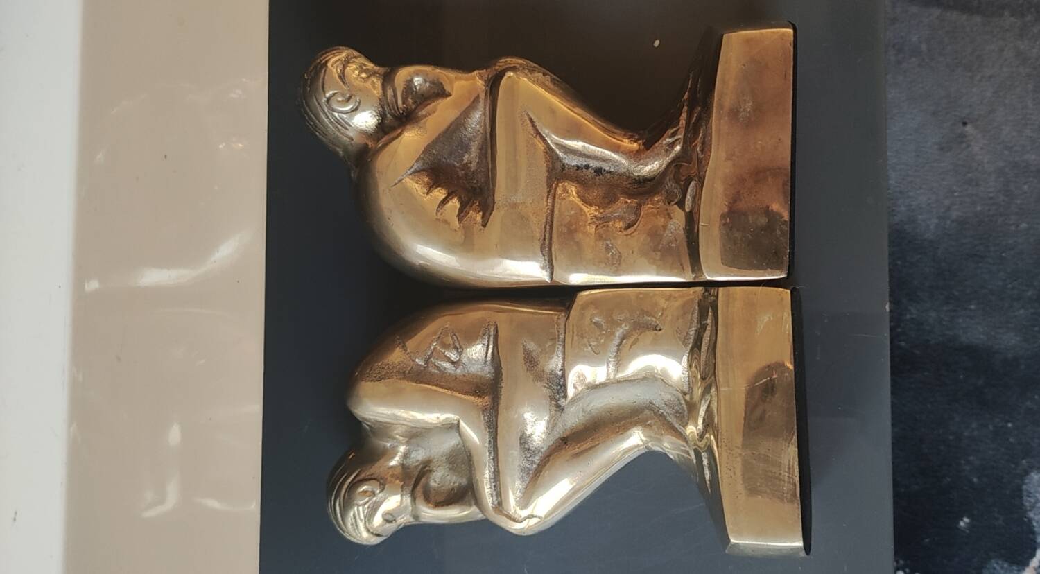 Pair of bookends inspired by Rodin's The Thinker. In gilt bronze