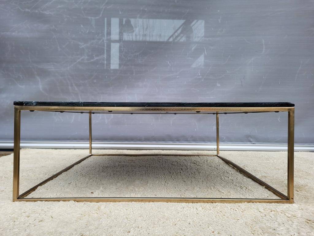 Coffee table or black marble and brass display "in its own juice"