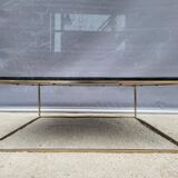 Coffee table or black marble and brass display "in its own juice"