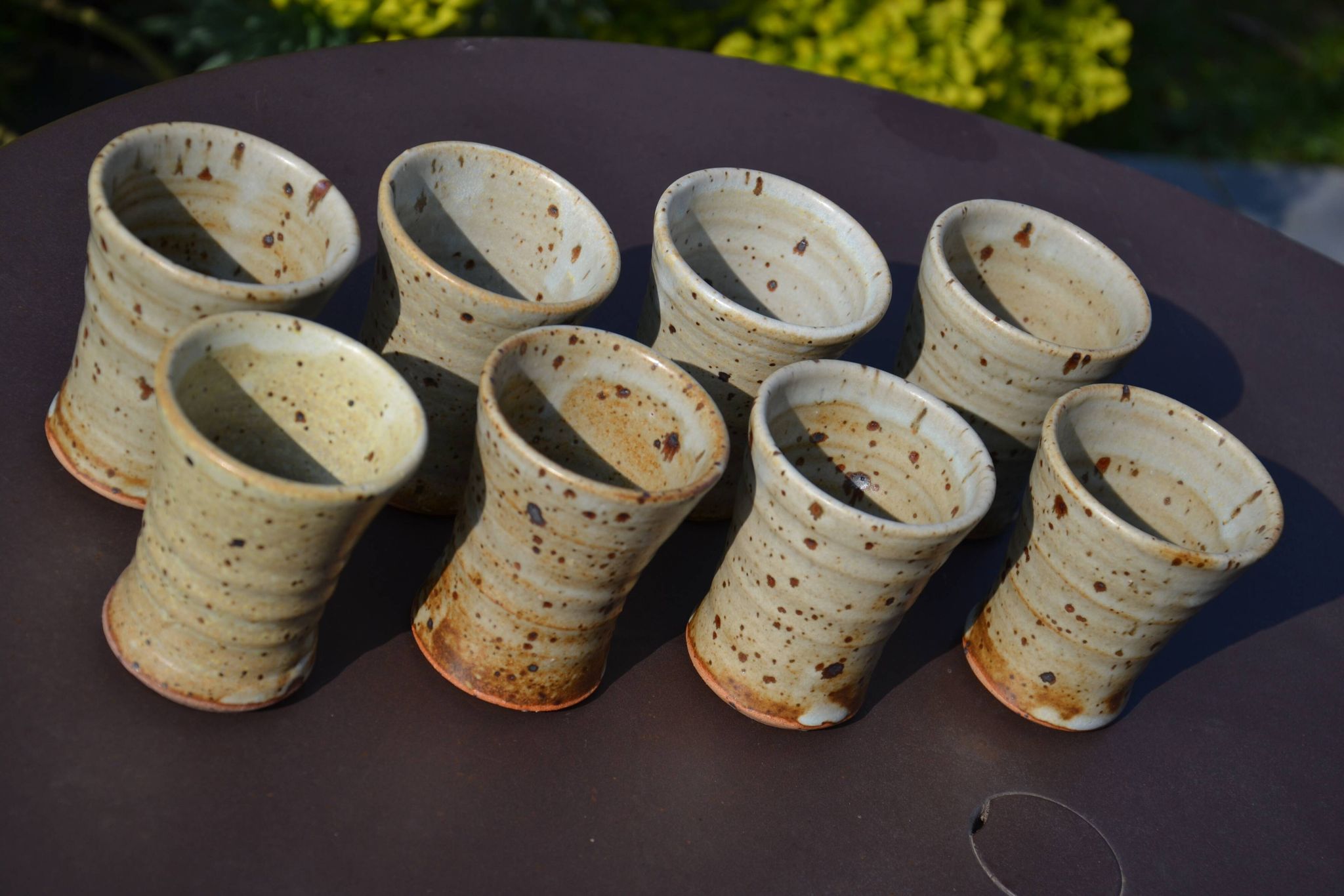 8 stoneware cups/mugs by Gustave Tiffoche